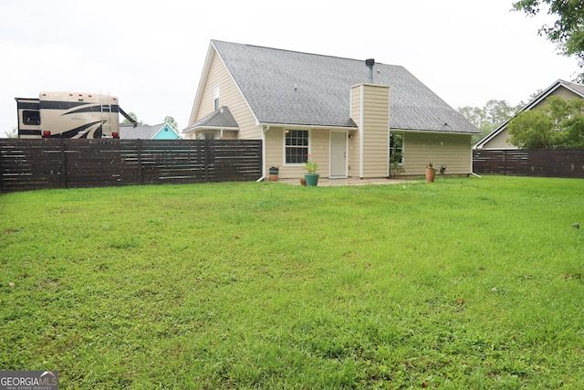 521 Lake Jordan Blvd W, Kingsland, GA 31548 - back of house featuring roof with shingles and a chimney