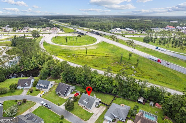 521 Lake Jordan Blvd W, Kingsland, GA 31548 - aerial view of property and surrounding area with nearby suburban area and a forest