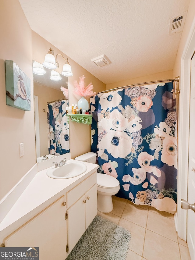 521 Lake Jordan Blvd W, Kingsland, GA 31548 - full bathroom with tile patterned floors, vanity, and a textured ceiling