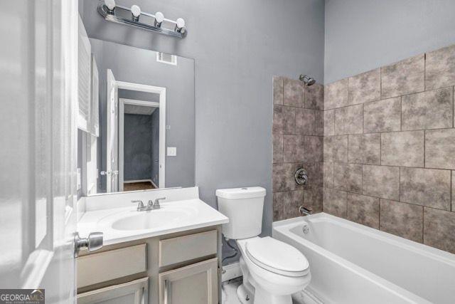 2505 Tiffany Ct, Conyers, GA 30013 - full bathroom with toilet, vanity, and shower / tub combination