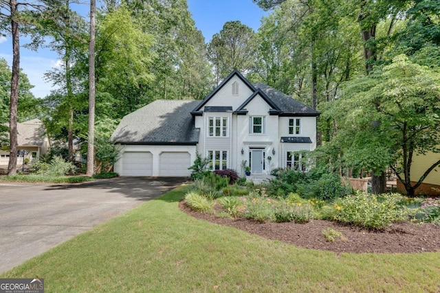 3250 Cobbs Farm Trl NW, Marietta, GA 30064 - view of front of house featuring driveway, a garage, roof with shingles, and view of scattered trees