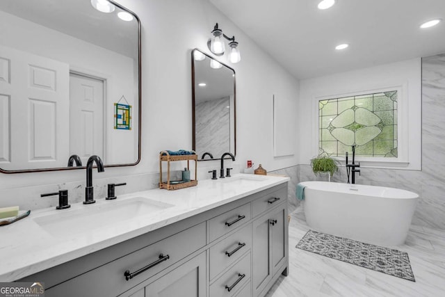 3250 Cobbs Farm Trl NW, Marietta, GA 30064 - bathroom featuring double vanity, a freestanding tub, recessed lighting, and marble finish floors