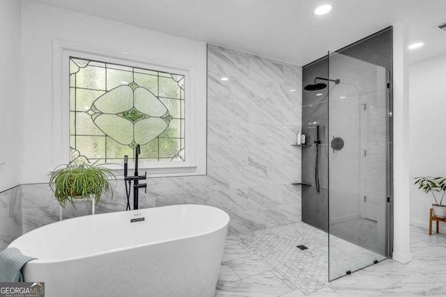 3250 Cobbs Farm Trl NW, Marietta, GA 30064 - bathroom featuring marble look tiles, walk in shower, a freestanding tub, tile walls, and recessed lighting