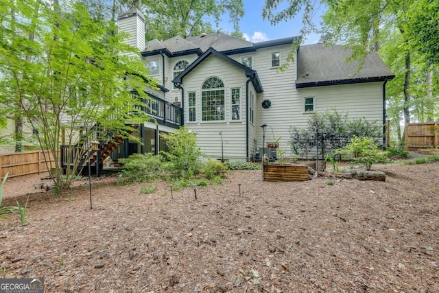 3250 Cobbs Farm Trl NW, Marietta, GA 30064 - rear view of house with stairway, a deck, a garden, a chimney, and a shingled roof