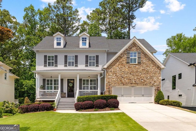 1596 Fearn Cir NE, Brookhaven, GA 30319 - view of front facade featuring stone siding, an attached garage, driveway, covered porch, and a front yard