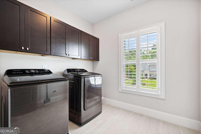 1596 Fearn Cir NE, Brookhaven, GA 30319 - laundry room with cabinet space, washing machine and clothes dryer, and baseboards