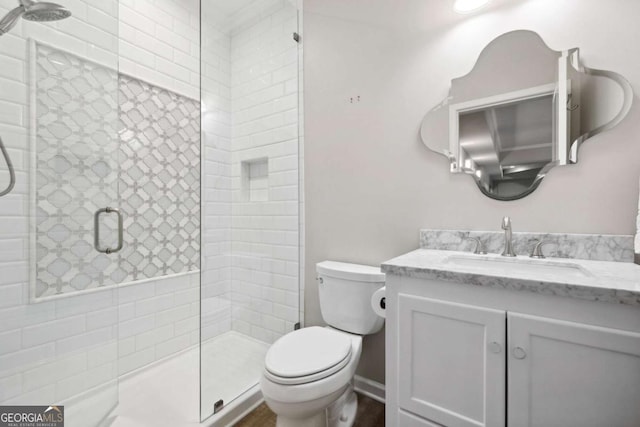 1596 Fearn Cir NE, Brookhaven, GA 30319 - bathroom with vanity, toilet, and a tile shower