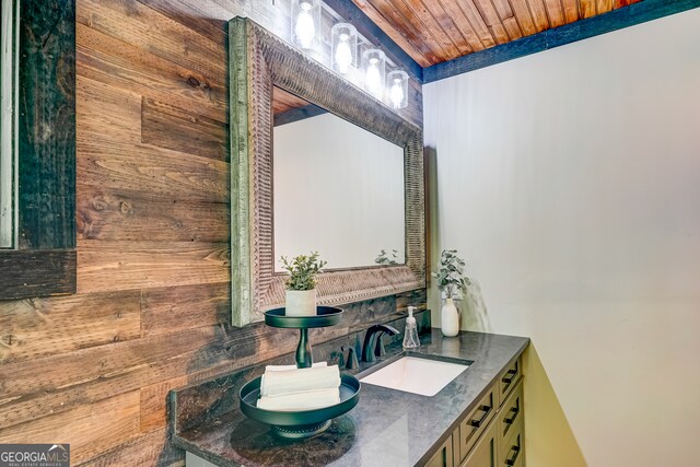 81 Falcon Cir Unit 2, Ellijay, GA 30540 - bathroom featuring wood walls, double vanity, and wood ceiling