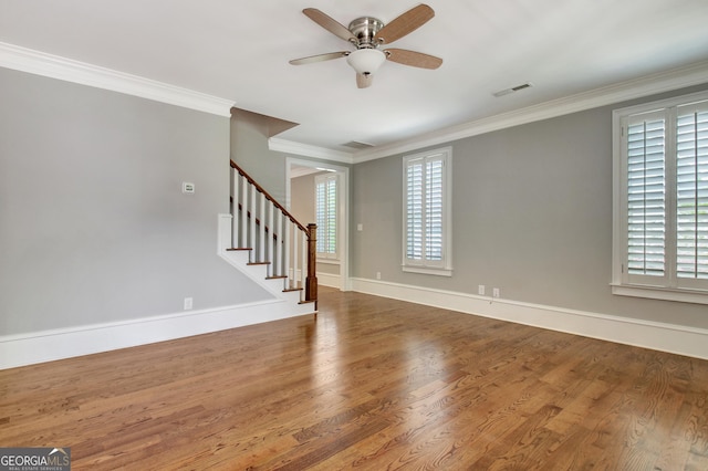 46 Horseshoe Bend Way, Senoia, GA 30276 - spare room featuring ceiling fan, plenty of natural light, stairway, wood finished floors, and crown molding