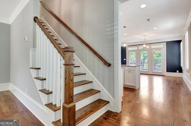 46 Horseshoe Bend Way, Senoia, GA 30276 - stairway with ornamental molding, wood finished floors, recessed lighting, baseboards, and a chandelier