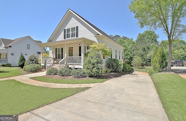 46 Horseshoe Bend Way, Senoia, GA 30276 - view of front facade featuring covered porch, a front yard, and concrete driveway
