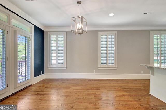46 Horseshoe Bend Way, Senoia, GA 30276 - unfurnished dining area featuring a chandelier, light wood-style flooring, crown molding, and baseboards