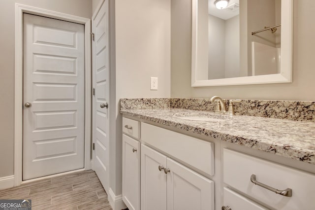 46 Horseshoe Bend Way, Senoia, GA 30276 - full bath with vanity, wood finished floors, and baseboards