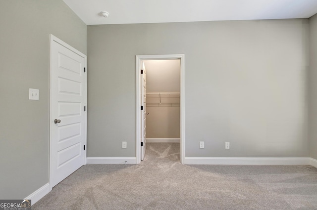 46 Horseshoe Bend Way, Senoia, GA 30276 - unfurnished bedroom with carpet flooring, baseboards, and a spacious closet