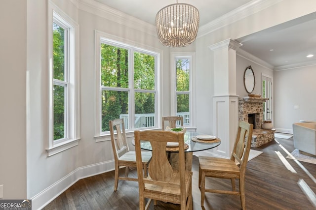 15626 Birmingham Hwy, Alpharetta, GA 30004 - dining area featuring dark wood-style floors, a chandelier, a fireplace, and crown molding