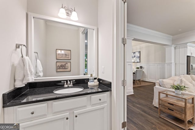 15626 Birmingham Hwy, Alpharetta, GA 30004 - bathroom featuring ornamental molding, vanity, wood finished floors, wainscoting, and a decorative wall