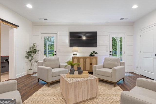 15626 Birmingham Hwy, Alpharetta, GA 30004 - living area featuring recessed lighting, wood finished floors, a barn door, and wood walls