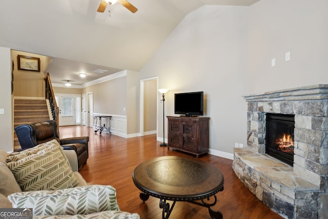 3491 Amerigo Dr, Buford, GA 30519 - living area with wood finished floors, stairs, a fireplace, ceiling fan, and high vaulted ceiling