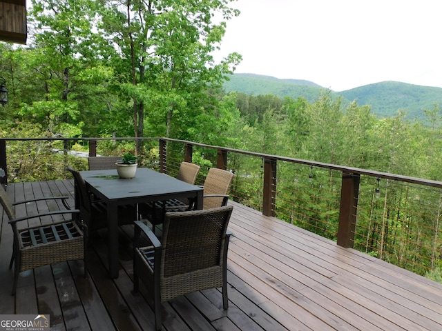 457 Monroe Ridge Rd, Sautee Nacoochee, GA 30571 - deck with outdoor dining area, a view of trees, and a mountain view