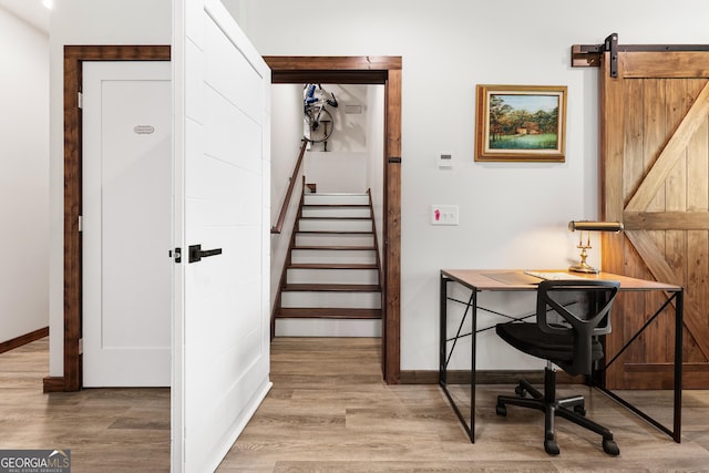 457 Monroe Ridge Rd, Sautee Nacoochee, GA 30571 - office with a barn door, wood finished floors, and baseboards