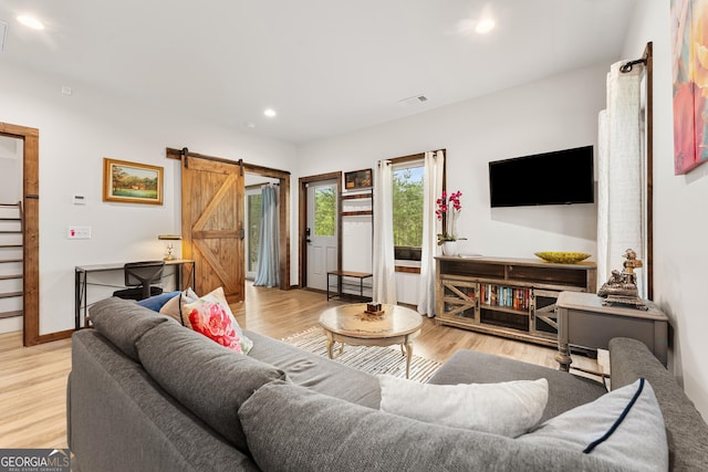 457 Monroe Ridge Rd, Sautee Nacoochee, GA 30571 - living room with a barn door, recessed lighting, light wood-type flooring, and baseboards