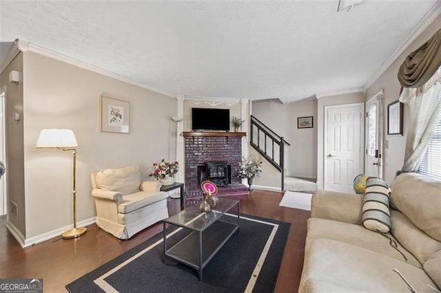 244 Timber Creek Ln, Marietta, GA 30060 - living room featuring wood finished floors, stairway, crown molding, a textured ceiling, and a fireplace