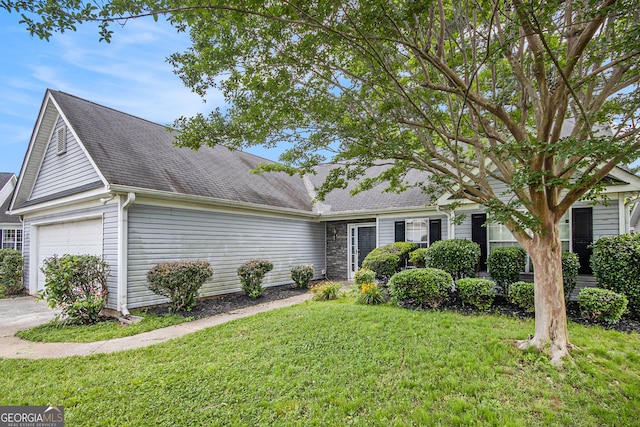 104 Terrapin Ct, Carrollton, GA 30116 - view of front facade with a front lawn, roof with shingles, and an attached garage