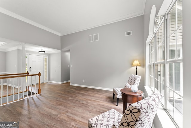 40 Wenham Ln, Sharpsburg, GA 30277 - living area with crown molding, baseboards, and wood finished floors