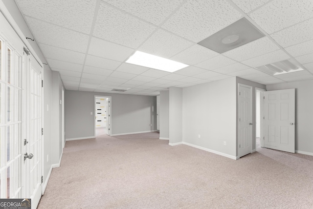 40 Wenham Ln, Sharpsburg, GA 30277 - basement featuring light carpet, a paneled ceiling, and baseboards