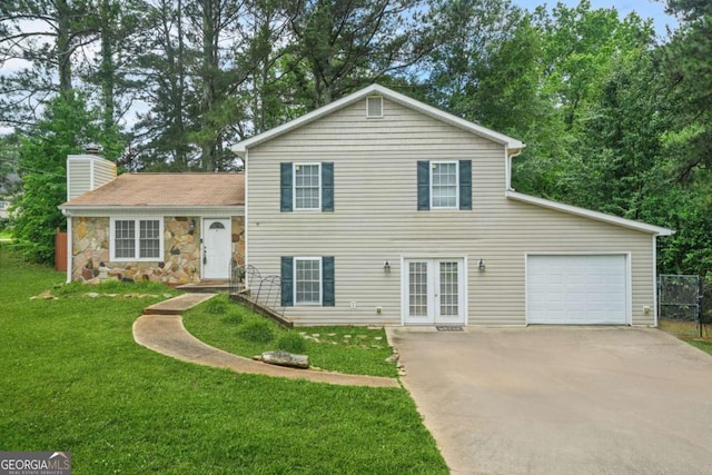2959 Pritchards Mill Trl, Douglasville, GA 30135 - split level home with french doors, concrete driveway, a chimney, a front lawn, and an attached garage