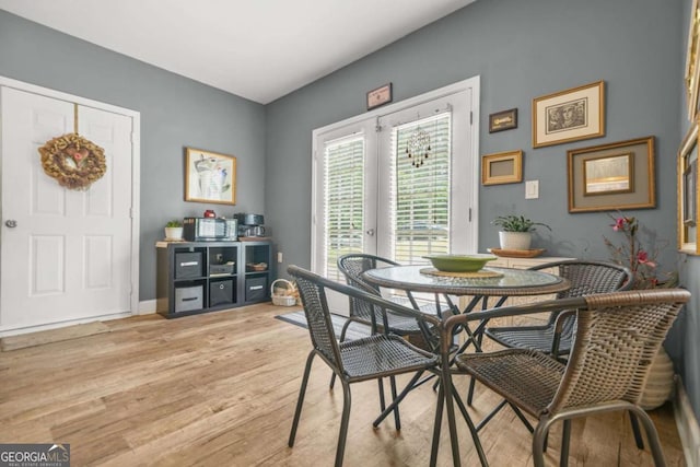 2959 Pritchards Mill Trl, Douglasville, GA 30135 - dining room with light wood finished floors and baseboards