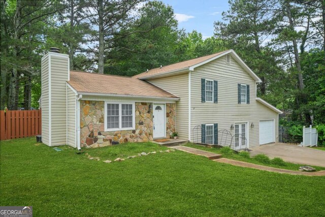 2959 Pritchards Mill Trl, Douglasville, GA 30135 - tri-level home with a chimney, concrete driveway, french doors, stone siding, and a shingled roof