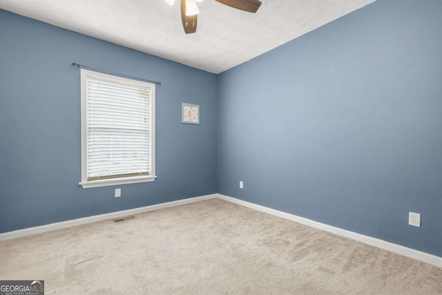 2959 Pritchards Mill Trl, Douglasville, GA 30135 - carpeted empty room featuring a ceiling fan, a textured ceiling, and baseboards