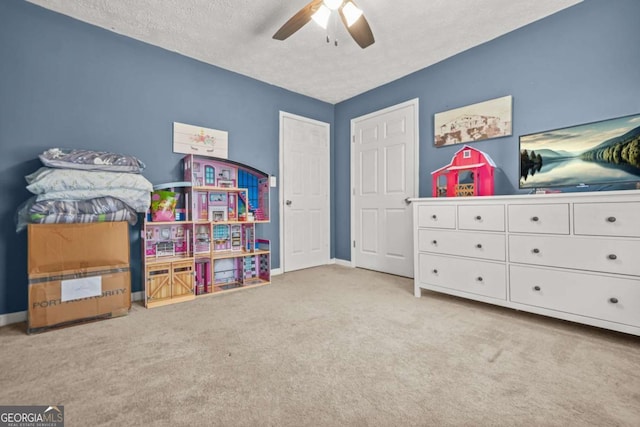 2959 Pritchards Mill Trl, Douglasville, GA 30135 - game room featuring ceiling fan, carpet floors, a textured ceiling, and baseboards