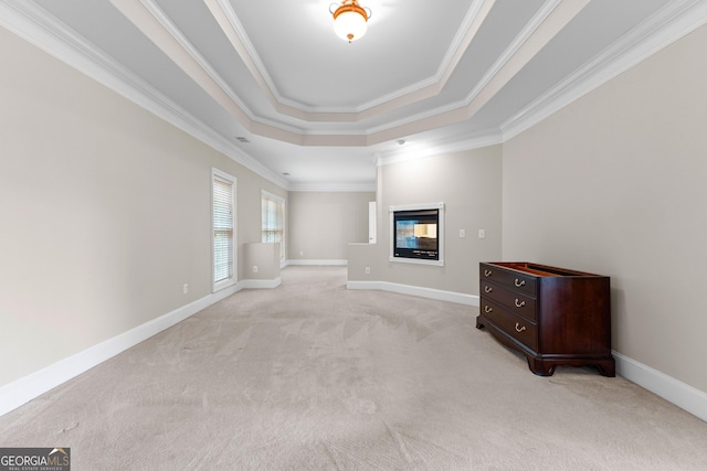 160 Torrey Pines Ct, Newnan, GA 30265 - unfurnished living room featuring light carpet, a tray ceiling, a multi sided fireplace, crown molding, and baseboards