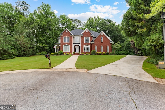 160 Torrey Pines Ct, Newnan, GA 30265 - view of front of house with a front lawn, concrete driveway, and brick siding