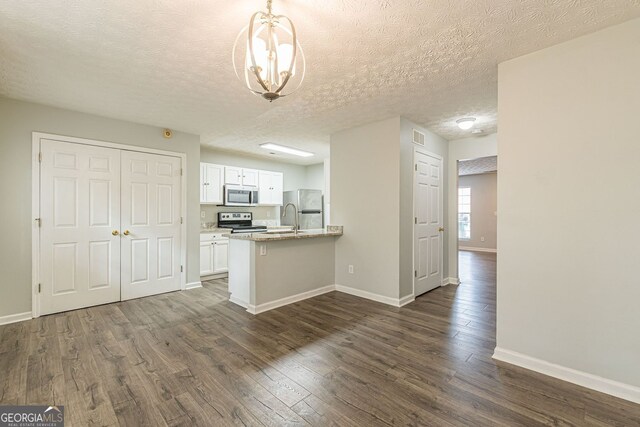 3151 Kingswood Gln, Decatur, GA 30034 - kitchen featuring stainless steel appliances, white cabinets, dark wood finished floors, baseboards, and a textured ceiling