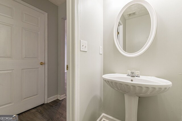 3151 Kingswood Gln, Decatur, GA 30034 - bathroom featuring wood finished floors, baseboards, and a sink