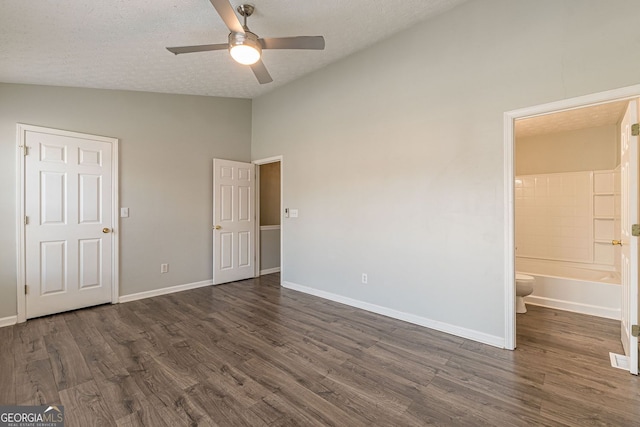 3151 Kingswood Gln, Decatur, GA 30034 - unfurnished bedroom with lofted ceiling, a textured ceiling, dark wood finished floors, ensuite bath, and baseboards