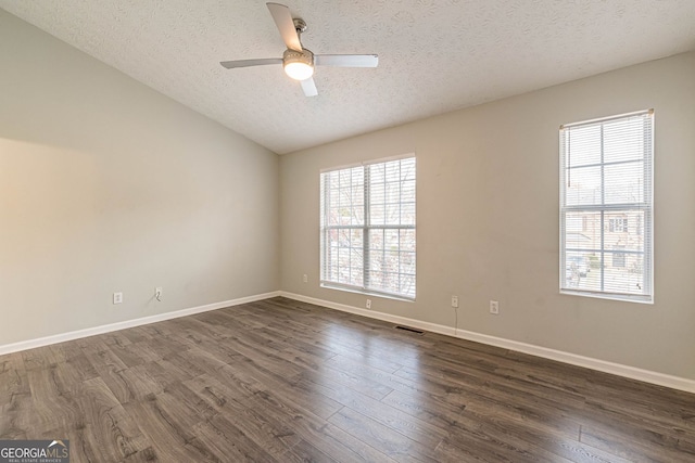 3151 Kingswood Gln, Decatur, GA 30034 - empty room with a textured ceiling, ceiling fan, dark wood-style flooring, baseboards, and vaulted ceiling