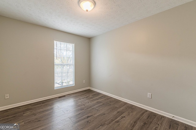3151 Kingswood Gln, Decatur, GA 30034 - spare room featuring dark wood-style floors, baseboards, and a textured ceiling