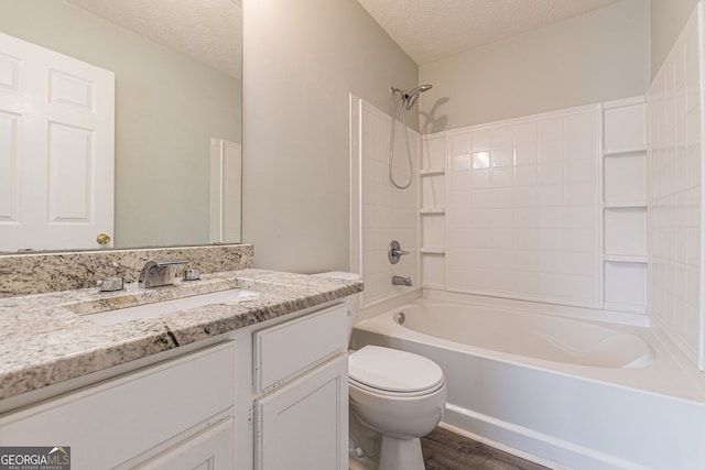 3151 Kingswood Gln, Decatur, GA 30034 - bathroom featuring toilet, vanity, a textured ceiling, bathtub / shower combination, and wood finished floors
