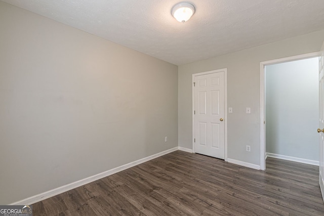 3151 Kingswood Gln, Decatur, GA 30034 - spare room with dark wood-style flooring, baseboards, and a textured ceiling