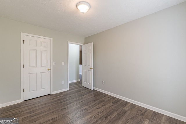 3151 Kingswood Gln, Decatur, GA 30034 - unfurnished bedroom with dark wood finished floors and baseboards