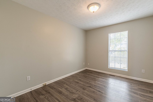 3151 Kingswood Gln, Decatur, GA 30034 - empty room with dark wood finished floors, baseboards, and a textured ceiling