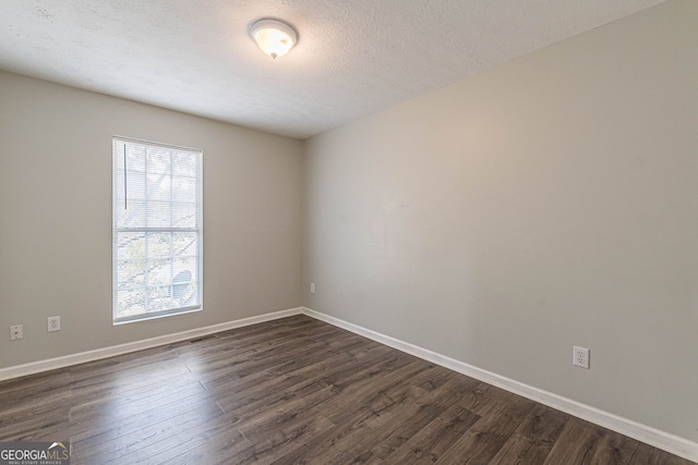 3151 Kingswood Gln, Decatur, GA 30034 - empty room featuring dark wood-type flooring, baseboards, and a textured ceiling