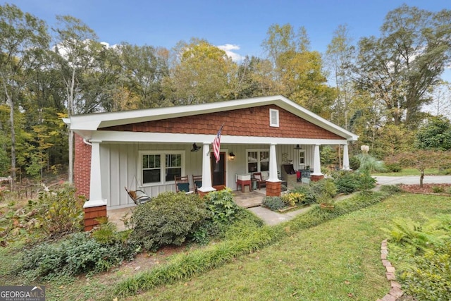4442 Mclain Cir, Acworth, GA 30101 - view of front of house featuring board and batten siding, a porch, and a front yard