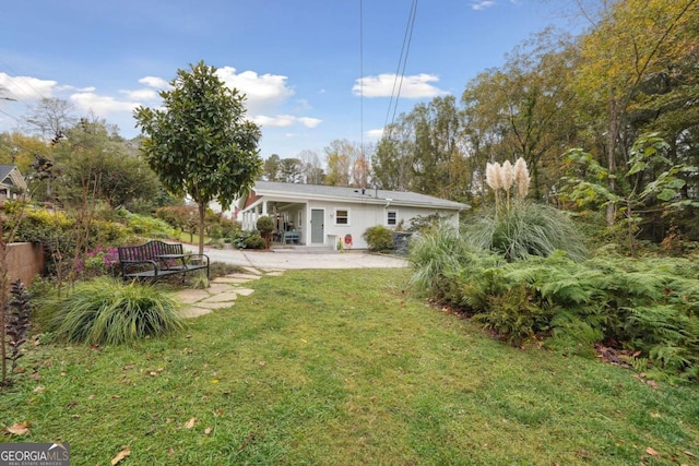 4442 Mclain Cir, Acworth, GA 30101 - rear view of property featuring a patio area and a lawn