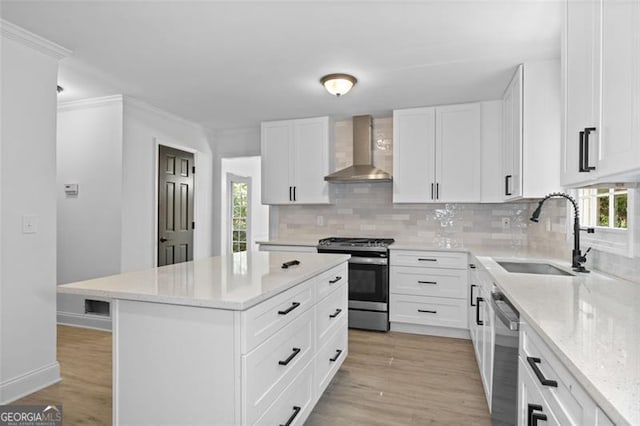 4166 Riverhill Ct, Roswell, GA 30075 - kitchen with wall chimney range hood, appliances with stainless steel finishes, backsplash, a center island, and plenty of natural light