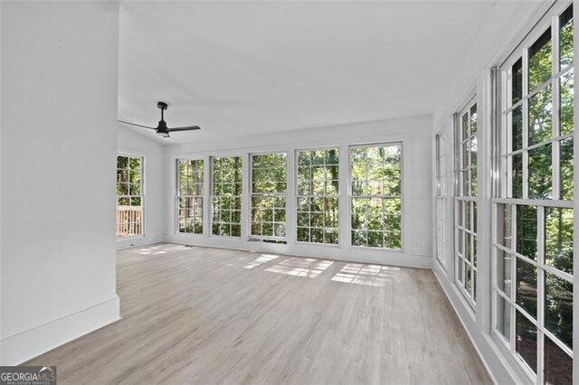 4166 Riverhill Ct, Roswell, GA 30075 - unfurnished sunroom with plenty of natural light, a wooden deck, and wood finished floors